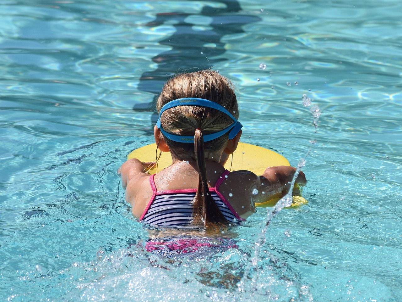 A girl swimming in a pool.